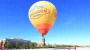 The girls and Wayde get in the hot air balloon.