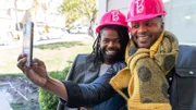 Anthony and Michel take a seflie as they get ready for some demo in the small space that they will transform into Barbie’s Office, as seen on Barbie Dream House Challenge, Season 1.