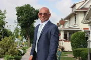 Host Anthony Melchiorri smiles on the streets of Hershey, Pennsylvania,.