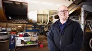 1 contributor in Hangar with plane in background
