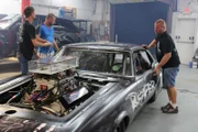 The Reaper working on his car just before he gets the news from Big Chief that they want him to race.
