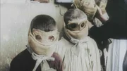 The use of gas as a chemical weapon as early as 1915 strikes terror among the troops, but also among the civilians. These children wear masks to protect them from a gas attack that could spread in their village.  (photo credit: ECPAD)