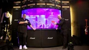 Wayde King and Brett Raymer from Acrylic Tank Manufacturing stand next to the custom built Kiss fish tank found within the Kiss Monster Mini Golf Course in Las Vegas, Nevada.