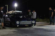 Doc pulls his car up to the start line to begin his race against Murder Nova.