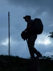 A member of the Expedition Unknown crew roaming the site of a possible Chupacabra attack in Barceloneta, Puerto Rico.