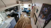 From the top of the staircase it is easy to see the kitchen and living room below in the Pirkul tiny house in Austin, Texas, as seen on HGTV's Tiny House Big Living.