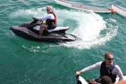 Glenn Stearns and John Elway relax with a little jet skiing off the Florida coast.