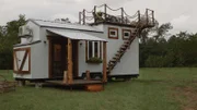 Daniel and April Phelan's tiny house is a gorgeous, custom piece of art with a spacious rooftop deck for enjoying time outdoors with family and friends, as seen on Tiny House, Big Living.