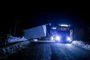 Overhalla, Norway - Total picture of the accident. The Towing Truck and the Truck in the ditch. The truck is blocking the road.