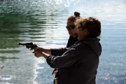 PORT PROTECTION, ALASKA- Mary Miller teaches Amanda Makar how to shoot a gun. (Photo Credit: National Geographic Channels/Corey Cooper)