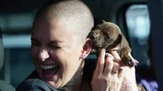 Yoshi nibbles on Amanda’s ear in the transport van.