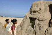 Local visitors look at a lion head monument which was uncovered by the Dec. 26 tsunami near the Shore Temple at Mahabalipuram, 45 miles south of Madras, India, Thursday Feb. 17, 2005. Archaeologists began shoreline and underwater excavations of an ancient port city and parts of a temple which was uncovered by the receding waters of the recent tsunami that struck south Asia on Dec. 26. (AP Photo M. Lakshman)