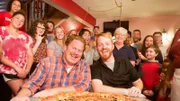 Host Casey Webb and his challenge teammate Ryan Maassen get ready to take on Schiappa's 29 inch pizza challenge, as seen on Travel Channel's Man v. Food.