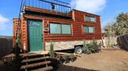 The finished exterior of Chad Steen's tiny smart home is a contrast in itself, with it's warm, inviting log cabin style exterior, complimented by the highly technological and sleek, modern interior, in Plano, Texas, as seen on Tiny House, Big Living.