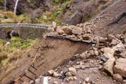 A rock fall destroyed the road during landslide after heavy rain
