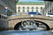 Picture Shows: Jeremy Clarkson skippers a hovercraft and navigates a low bridge in St. Petersburg
