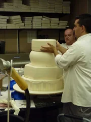 Fast Food Groom's cake and Beer Boot cake. Buddy and Mauro Castano begin stacking the wedding cake for Buddy's sister-in law Daniela.
