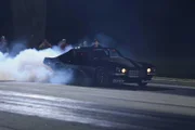 Monza performs a burnout before his grudge race against Shane.