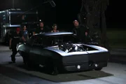The Reaper and crew push his car up to the starting line.