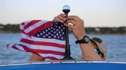 Warden McGinley tying up American flag.