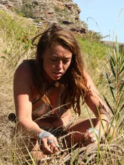 Gabrielle setting up her snare in hopes of catching food in South Africa.