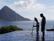 Giles Coren with Devan cleaning pool at Jade Mountain