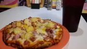A small pizza from Rock Island Caf? in Honolulu, as seen on Food Network's Mystery Diners, Season 8.