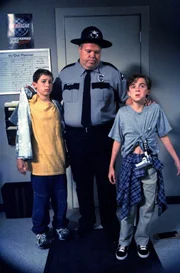 L-R: Reese (Justin Berfield), Officer Karl (Joel McKinnon Miller), Malcolm (Frankie Muniz)