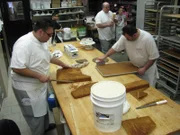Frankie and Danny begin trimming and preparing to stack the Medieval Times Cake, as seen in 'Cake Boss' series 3 featured in episode 307.