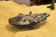 Selected focused scale model of Millennium Falcon space ship from Star Wars franchise movies.