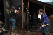 Bam Bam Brown using sledge hammer on demolition site, Gabe Brown with hammer.