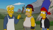 Nach dem Rauswurf aus Springfield verlassen Homer (M.), Bart, Marge (r.), Maggie und Lisa ihre Heimatstadt und schließen sich einer autarken Gemeinde außerhalb der Stadt an. Dort treffen sie auf Julian Assange (l.), ihren neuen Nachbarn ...