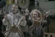 Brenna A Captain Sean Dwyer and Coordinating Producer Lisa Roberts display large crab for the camera.