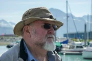 Vernon Adkison in a fisherman cap and sunglasses.