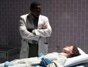 Dr. Eric Foreman (Omar Epps), Victoria (Leslie Hope)