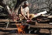 UTAH- Matt preparing his jerky near his fire. (Photo credit:  NG Studios/ Griffin Kenemer)