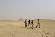 Dahshur, Egypt - (From left to right) Malcolm Williamson, Steve Burrows, Caitlin Stevens and Dallas Campbell talking about pyramid construction at Dashur.
