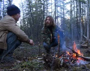 Bear and Matt build a fire to keep the ground from freezing.