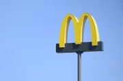 McDonalds logo on blue sky background