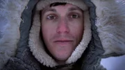 Alex Javour in below freezing temperatures while at his cabin in Bear Creek, Alaska. (National Geographic/Ben Mullen)
