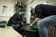 L-R: Shawn Pomrenke and Cody Moen panning in clean out shed.