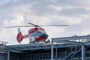 red helicopter on the roof of a accident hospital in berlin, the helicopter is prepared for ambulance and emergency services