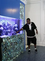 Tracy shows the guys his live reef tank.
