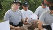 Angel Miller sits with other trainees.