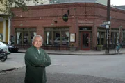 Owner Roland stands outside his restaurant, Marigny Brasserie, in New Orleans, Louisiana.