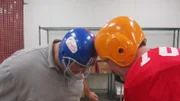 Frankie and Danny knock heads while dressed in football gear.