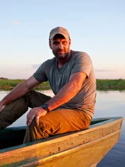 Ed Stafford looking over the harbour in Mongu, Zambia.