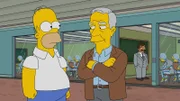 Voller Stolz erhält Homer (l.) die Möglichkeit, mit den besten Professoren Amerikas Roboter zu unterrichten. Unter ihnen ist auch der amerikanische Schriftsteller und Professor Robert McKee (r.) ...