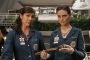 BONES:  Brennan (Emily Deschanel, R) and Angela (Michaela Conlin, L) examine a burned corpse in the BONES season two premiere episode "The Titan on the Tracks" airing Wednesday, Aug. 30 (8:00-9:00 PM ET/PT) on FOX.  ©2006 Fox Broadcasting Co.  Cr:  Carin Baer/FOX