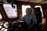 Mandy Hansen, Captain on the Northwestern, takes the wheel and takes it very seriously.
